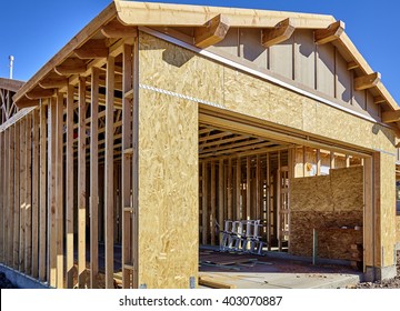 Construction Home Building Industry Carpentry And Sitework Details In Progress/carpentry Construction Framing And Siding New Home Garage And Gable Roof