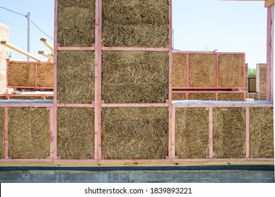 Construction of a house from an environmentally friendly material of plant origin. Frame made of wood, blocks of straw. - Shutterstock ID 1839893221