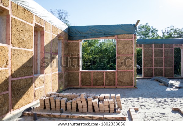Construction\
of a house from an environmentally friendly material of plant\
origin. Frame made of wood, blocks of\
straw.