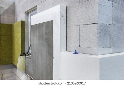 Construction Of A House And Insulation Of The Wall Of The House With Layers Of Modern Thermal Insulation Materials