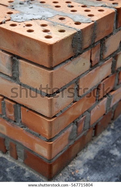 Construction of houses, masonry walls made of red\
bricks and cement
