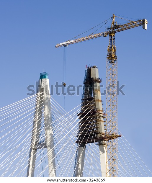 Construction industrial site - bridge\
assembling with huge crane and\
falsework