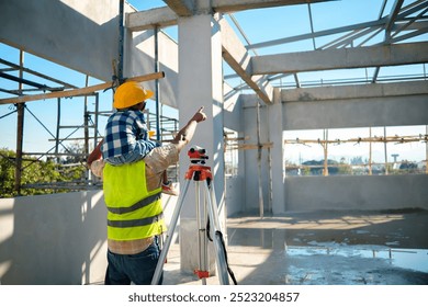 Construction industry worker with young boy builder building a future concept, architect engineer planning design, communication teamwork, working together building site, wearing hardhat. - Powered by Shutterstock