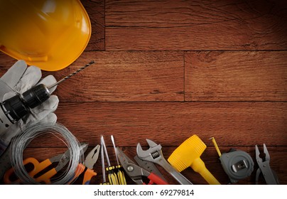 Construction instrument on wood background with copy space.