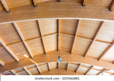Construction of a large wooden roof with solid wooden beams for high load capacity