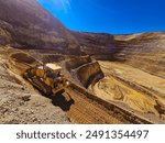 Construction machinery working in open pit mine.