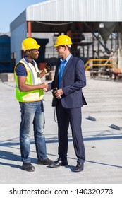 Construction Manager And Worker Handshake On Site