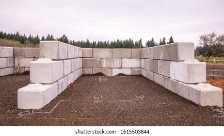 Construction Of A Manure Storage System Made Of A Large Heavy Concrete Blocks. 