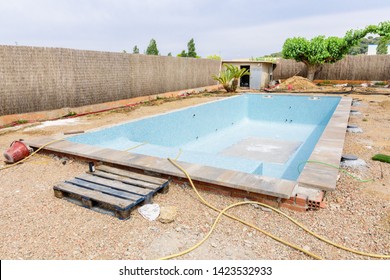 Construction Material On The Construction Site Of A Swimming Pool.