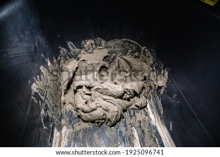 Construction material. Ready to use cement mixed in the right proportion with water. Close-up.