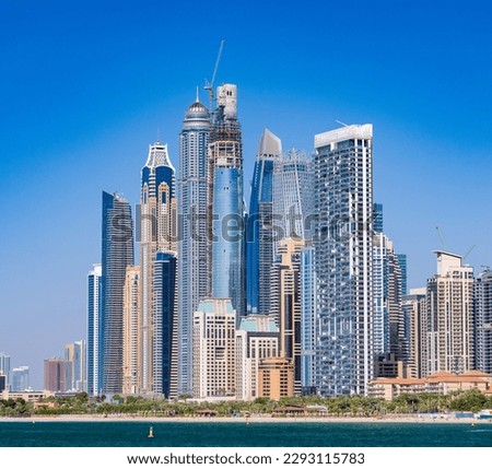 Construction of new apartments among hotels on oceanfront in Jumeirah Beach Residence area of Dubai