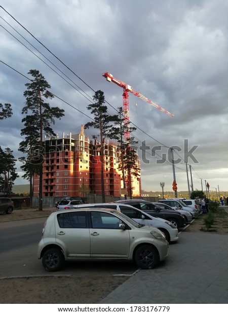 construction of a new building, construction\
crane, cars: Chita. Russia.\
25.07.20
