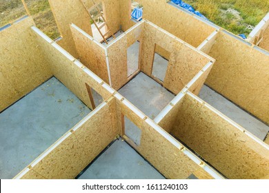 Construction Of New And Modern Modular House. Walls Made From Composite Wooden Sip Panels With Styrofoam Insulation Inside. Building New Frame Of Energy Efficient Home Concept.