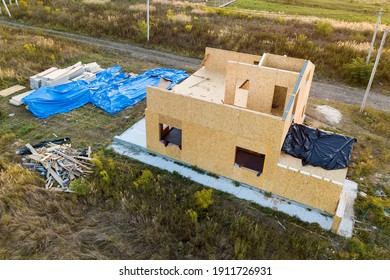 Construction Of New And Modern Modular House. Walls Made From Composite Wooden Sip Panels With Styrofoam Insulation Inside. Building New Frame Of Energy Efficient Home Concept.