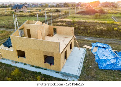 Construction Of New And Modern Modular House. Walls Made From Composite Wooden Sip Panels With Styrofoam Insulation Inside. Building New Frame Of Energy Efficient Home Concept.