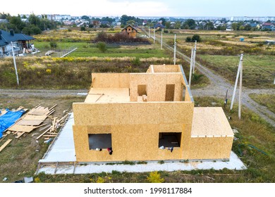 Construction Of New And Modern Modular House. Walls Made From Composite Wooden Sip Panels With Styrofoam Insulation Inside. Building New Frame Of Energy Efficient Home Concept.