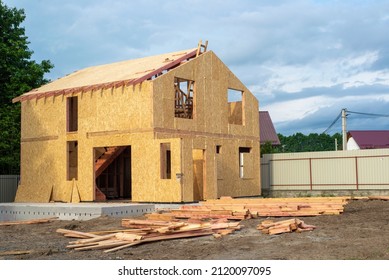 Construction Of New And Modern Modular House. Walls Made From Composite Wooden Sip Panels With Styrofoam Insulation Inside. Building New Frame Of Energy Efficient Home Concept.