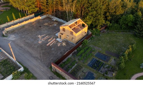 Construction Of New And Modern Modular House. Walls Made From Composite Wooden Sip Panels With Styrofoam Insulation Inside. Building New Frame Of Energy Efficient Home Concept.