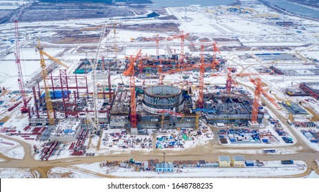 Construction Of A New Nuclear Power Plant In The City Of Kurchatov. Kursk NPP-2. Two Round-shaped Power Units. People And Equipment Are On The Construction Site.