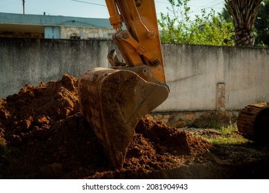 Construction On Road In Kpalime, Togo Using A Large Digger. 