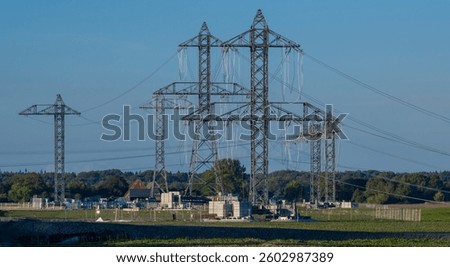 Construction of a phase shifter system to specifically control current flows in the power grid for energy generation