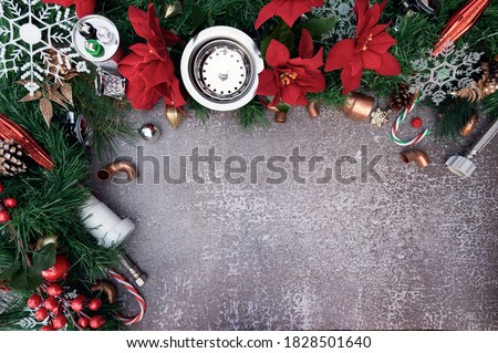 Construction and plumber tools on Christmas background. Plumbing supply over holiday decoration with space for text.	