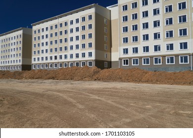 Construction Process And Development Of House Area, Land Grading Or Earthwork, Facade Of A New Multi-storey Building