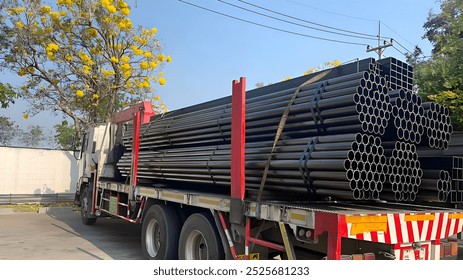 Construction products on transport vehicles Group of steel pipes for industrial materials Construction engineering products  equipment, steel pipes, metal warehouse industry, delivery to customers - Powered by Shutterstock