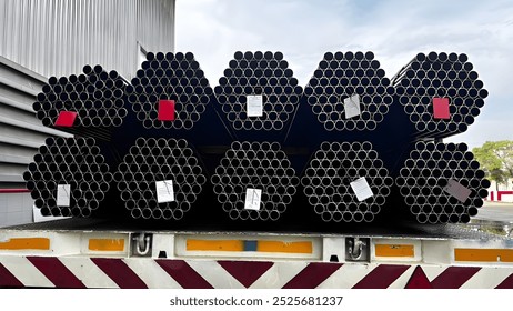 Construction products on transport vehicles Group of steel pipes for industrial materials Construction engineering products  equipment, steel pipes, metal warehouse industry, delivery to customers - Powered by Shutterstock