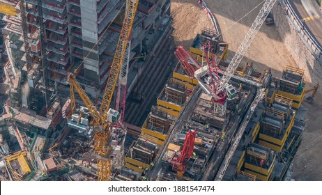 Construction Progress Of New Modern Skyscraper In Dubai City Aerial Timelapse, United Arab Emirates. Cranes And Building Equipment In Downtown