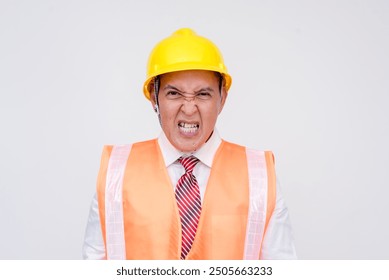 A construction project manager or engineer in a safety helmet and vest seething in anger due to incompetent subordinates. Isolated on a white background.