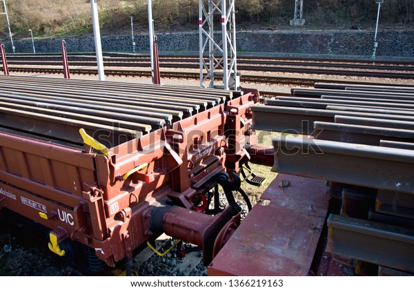 Construction of railway tracks. Railway\
infrastructure. Railroad car loaded with rails. Rails on a wagon\
ready for track\
construction