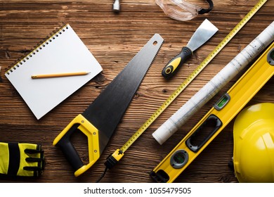 Construction And Renovation Concept. Contractor Tools, On Wooden Table. Top View Shot.