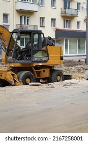 
Construction and repair of the road. City street. Tire tracks in the sand, building materials.