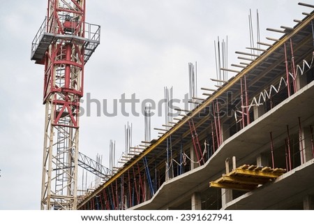 Construction of residential buildings. View of the construction of skyscrapers. Construction site with a tower crane. With space to copy. High quality photo