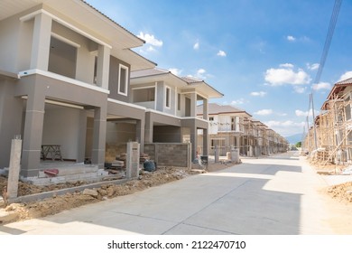 construction residential new house in progress at building site housing estate development - Powered by Shutterstock