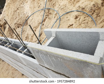 Construction Of A Retaining Wall From Concrete Blocks Of Permanent Formwork