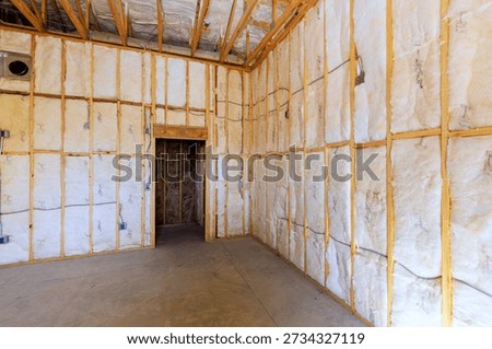 Construction reveals walls with insulation in developing building
