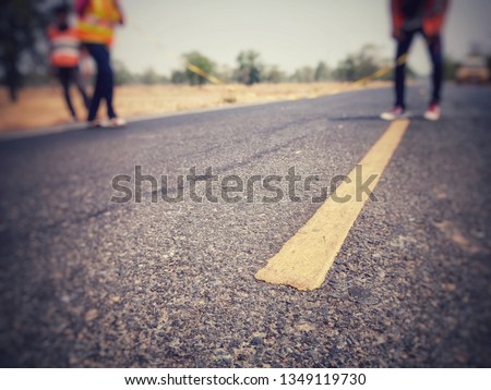 construction of a road with a composition of people, blurred images