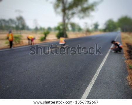 construction of a road with a composition of people, blurred images