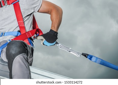 Construction Safety Technologies. Working At Height Contractor Safety Harness Closeup Photo. Steel Building Frame.