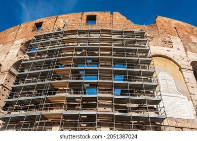 Construction scaffolding around the Colosseum, the iconic symbol of Imperial Rome is also known as the Flavian Amphitheatre. Conservation and renovation maintenance works of facade. - Powered by Shutterstock