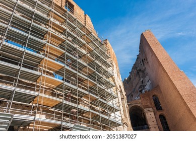 Construction scaffolding around the Colosseum, the iconic symbol of Imperial Rome is also known as the Flavian Amphitheatre. Conservation and renovation maintenance works of facade. - Powered by Shutterstock