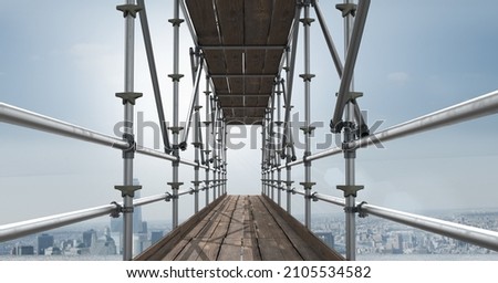 Construction scaffolding over a cityscape against clouds in the blue sky with copy space. modern architecture and engineering concept