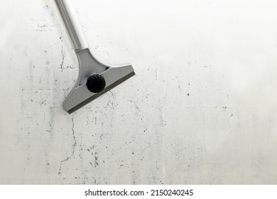 Construction scraper on gray wall background. Construction finishing works. Wall repair inside the room - Shutterstock ID 2150240245