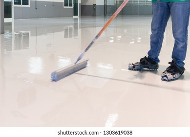 Construction Series: Worker Working On Epoxy Floor 