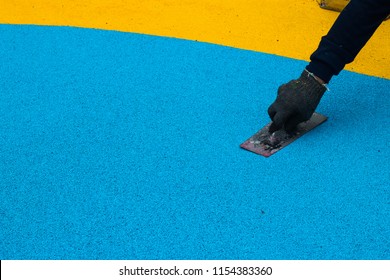 Construction Side Work. Making A Floor With The Rubber Beads -[EPDM].