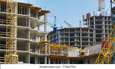 Construction site background. Hoisting cranes and new multi-storey buildings. I.ndustrial background.