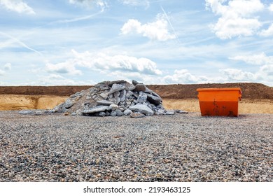 construction site, building site and rubble container, concrete debris piles on the ground. pile of concrete scraps. concrete blocks are piled up on the mounds. materials for construction industry