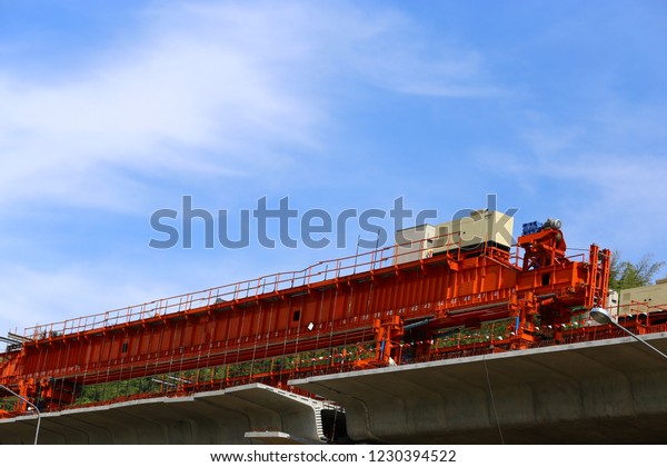 Construction site of car bridge,\
express way with red container and site over the flyover at\
outdoor